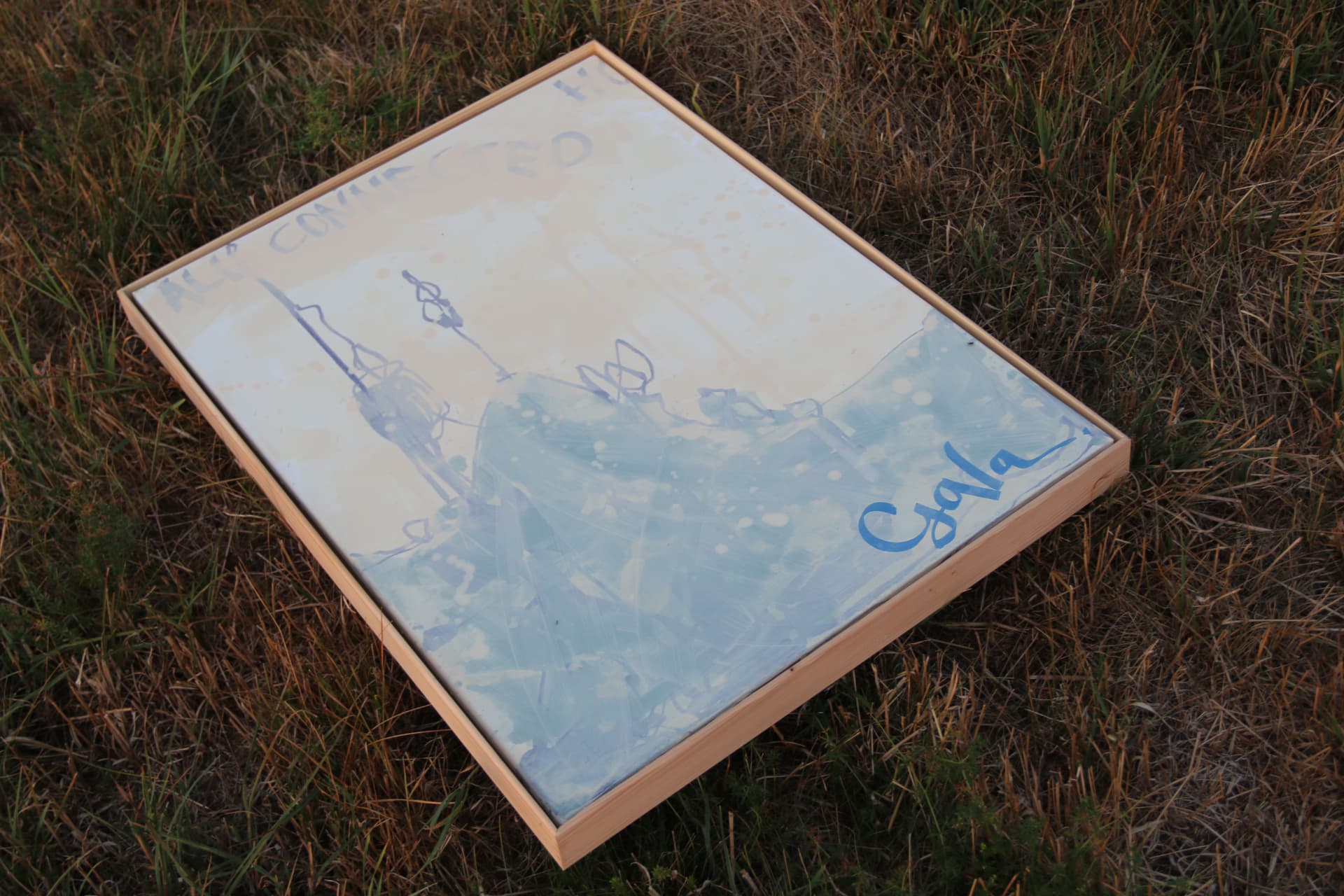 Painting signed GALA resting in the grass